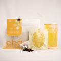 A product display of osmanthus oolong Tea from CHAWU featuring a large resealable pouch, an individual tea bag, loose tea leaves, and a glass of brewed golden-yellow tea on a white background.