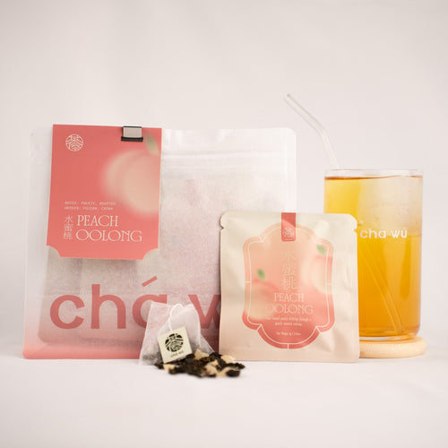 A tea product display on a light gray background, featuring a large resealable pouch, a single tea bag, loose tea leaves, and a glass of amber-colored tea with a straw. The packaging has pink and white designs with Chinese text and the brand name CHAWU partially visible.